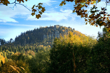 Autumn view on peak Stolowe Mountains from Pasterka village in Poland. Szczeliniec Maly, Small Szczeliniec. 