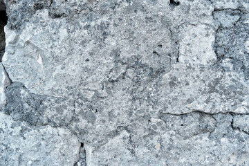 Dirty cement surface wall for background. Wall fragment with scratches and cracks. old grungy texture, grey concrete wall