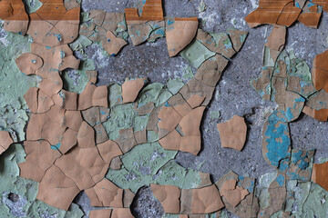 Peeling paint on the wall. Old concrete wall with cracked flaking paint. Weathered rough painted...