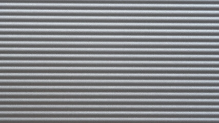 The texture of aluminium with horizontal fluting, background.