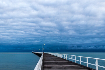 Cloud formations over sea Pier