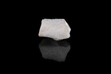 Raw Blue Calcite from Slyudyanka, Baikal, Russia on black glass background.