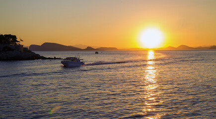 Fototapeta na wymiar Amazing orange sunset on grrek islands ( view from Hydra island)
