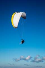 Europe, Austria, Dachstein, Paraglider soaring above Lake Hallstatt and the surrounding mountains, all of which is part of the Salzkammergut Cultural Landscape, UNESCO World Heritage Site