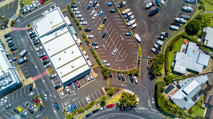 Aerial view on a busy plaza with car parking and residential houses nearby. Auckland, New Zealand.
