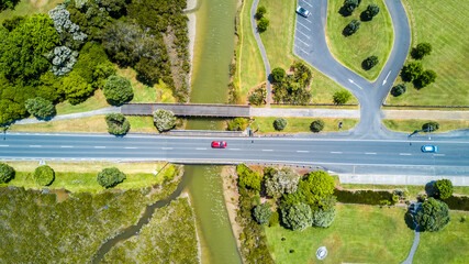 Aerial view on a bridge across a small river on a sunny day. Auckland, New Zealand.