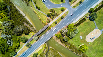 Aerial view on a bridge across a small river on a sunny day. Auckland, New Zealand.