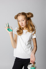 Cute girl on a white background with construction tools