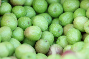 Pile of organic apples close up. Heap of healthy natural fruits at farmers market. Eco food concept.