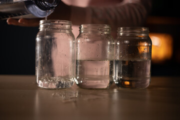 pouring water into glasses