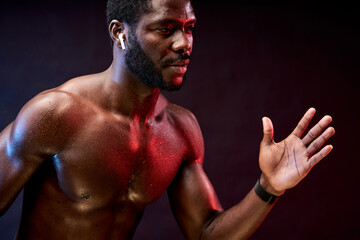 athlete male running, fit guy of african appearance concentrated on run competition, want to win