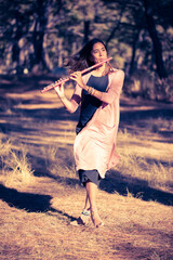 Indigenous woman playing the flute