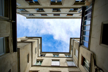 France, Paris, street scenes in Le Marais district, looking at the sky in a courtyard
