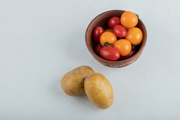 Fresh vegetables. Red cherry tomatoes and potatoes