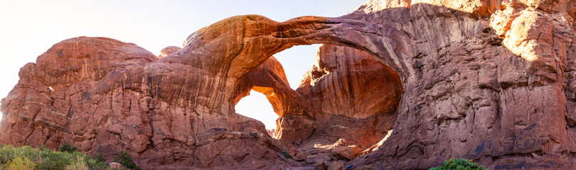 Panorama shot of red sandstone arches at summer sunny day in Arches national park in Utah, America