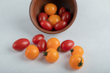 Fresh organic cherry tomatoes on white background