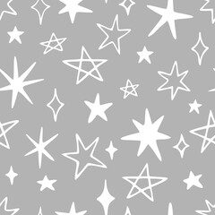 Vector seamless pattern with cute stars and sparkles. Hand drawn, doodle style. Design for fabric, wrapping, stationery, wallpaper, textile.