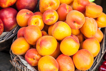 Naklejka na ściany i meble Fresh peaches on a market in Italy