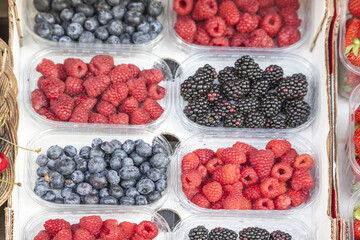Fresh Blueberries, Raspberries And Blackberries On A Market In Italy
