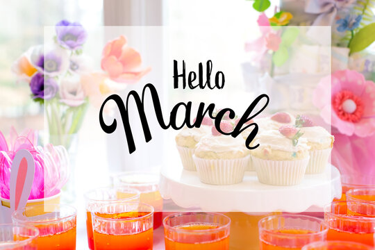 Hello March message with dessert table with cupcakes and flowers