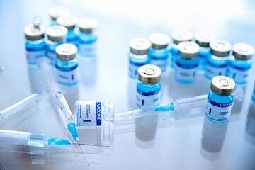 Coronavirus vaccine ampoules medical and syringe with a vaccine. Covid-19 vaccine research.