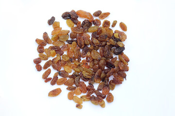 Raisins spread on white background,top view