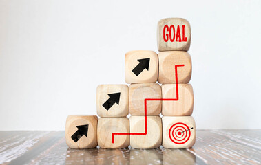 Pieces of wood, cubes and light box with message goal