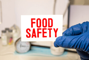 Doctor holding a card with text Food Safety, medical concept