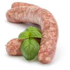 Raw sausage with basil leaf isolated on white background