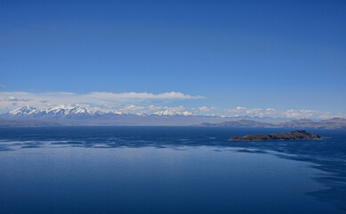 Naklejka na ściany i meble View of the entire Cordillera Real across Lake Titicaca, Isla del Sol, Bolivia