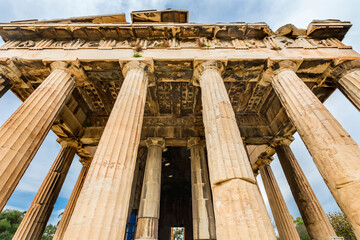 Naklejka premium Ancient Temple of Hephaestus. Columns Agora Marketplace, Athens, Greece. Agora founded 6th Century BC. Temple for God of craftsmanship, metalworking from 449 BC