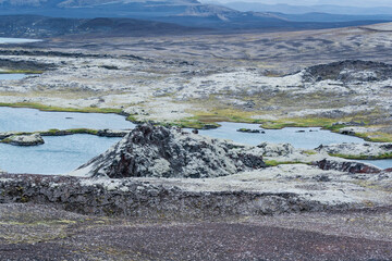 Iceland, Southern Highlands, Hrauneyjar. The rough volcanic landscape has small lakes among the rugged lava outcrops.
