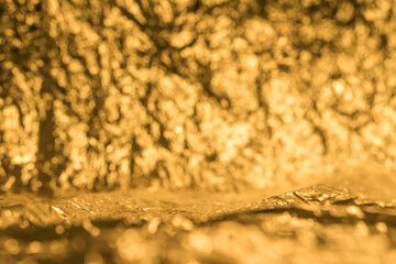 Golden presentation background with focus on foreground