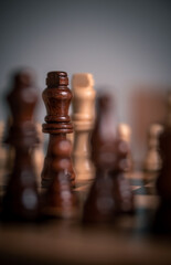 Chess pieces set up ready to play chess game on a wooden board strategy game kings head to head...