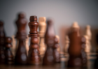 Chess pieces set up ready to play chess game on a wooden board strategy game kings head to head...