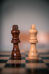 Chess pieces set up ready to play chess game on a wooden board strategy game kings head to head deadlocked