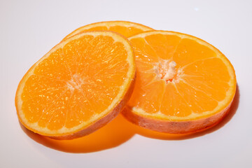 Clementines fruit slices isolated on white background closeup.