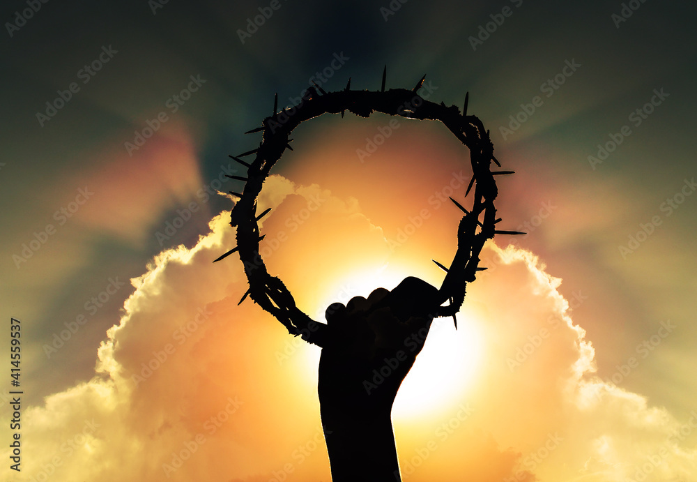 Wall mural hand of jesus christ with sky and rising sun, holding crown of thorns, critsão symbol of rebirth, fa