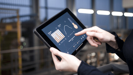smart worker using ar industrial analysis app on tablet mobile device © Stock57