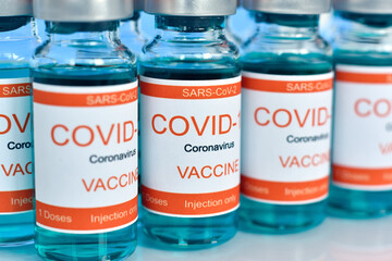 Covid-19 coronavirus vaccine vials with metal caps.