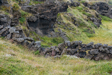 Iceland, Lake Myvatn Area. A low wall was constructed with volcanic stones.