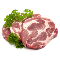 Raw pork neck chop meat with parsley herb leaves garnish isolated on white background cutout