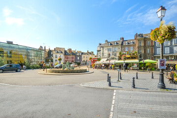The  statue memorializing the women of Honfleur who would harvest mussels from the sea in the historic center of Honfleur, France. - obrazy, fototapety, plakaty