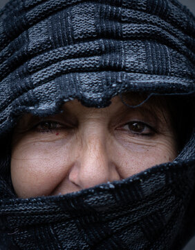 Closeup To The Eyes Of A Beautiful Middle Eastern Older Woman With A Veil Covering Part Of Her Face