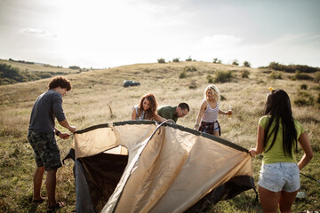 It Takes Teamwork To Set Up Their Tent