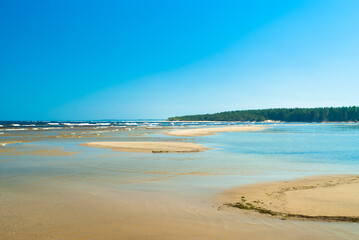 seashore, in the photo sea water against the blue sky