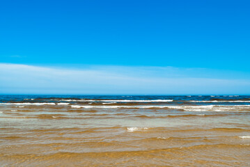 seashore, in the photo sea water against the blue sky