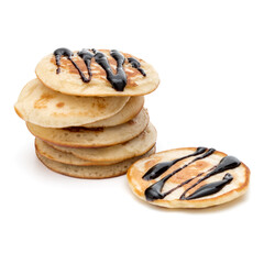 Pancakes  stack with chocolate syrup on white background