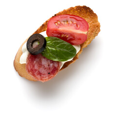 Open faced sandwich canape or crostini isolated on white background closeup. Top view.