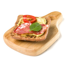 Open  faced sausage sandwich canape or crostini on a wooden serving board  isolated on white background closeup.